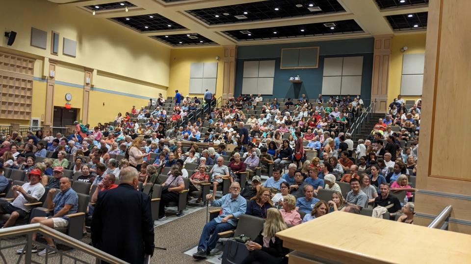 The auditorium of Central Middle School in Quincy fills with residents before a meeting about the temporary shelter for homeless families housed on the campus of Eastern Nazarene College.