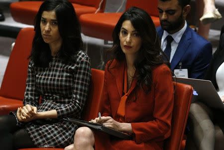 Activist Amal Clooney (R) attends a United Nations Security Council meeting set to adopt a resolution to help preserve evidence of Islamic State crimes in Iraq, during the 72nd United Nations General Assembly at U.N. Headquarters in New York, U.S., September 21, 2017. REUTERS/Brendan Mcdermid