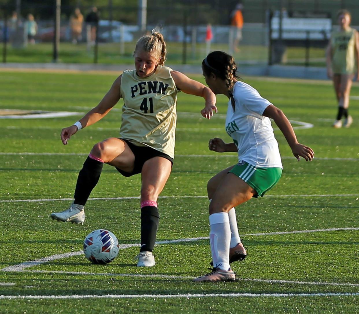 Penn junior Annika Guenther (41) dribbles the ball during a game against Concord Tuesday, Aug. 22, 2023 at Penn High School.