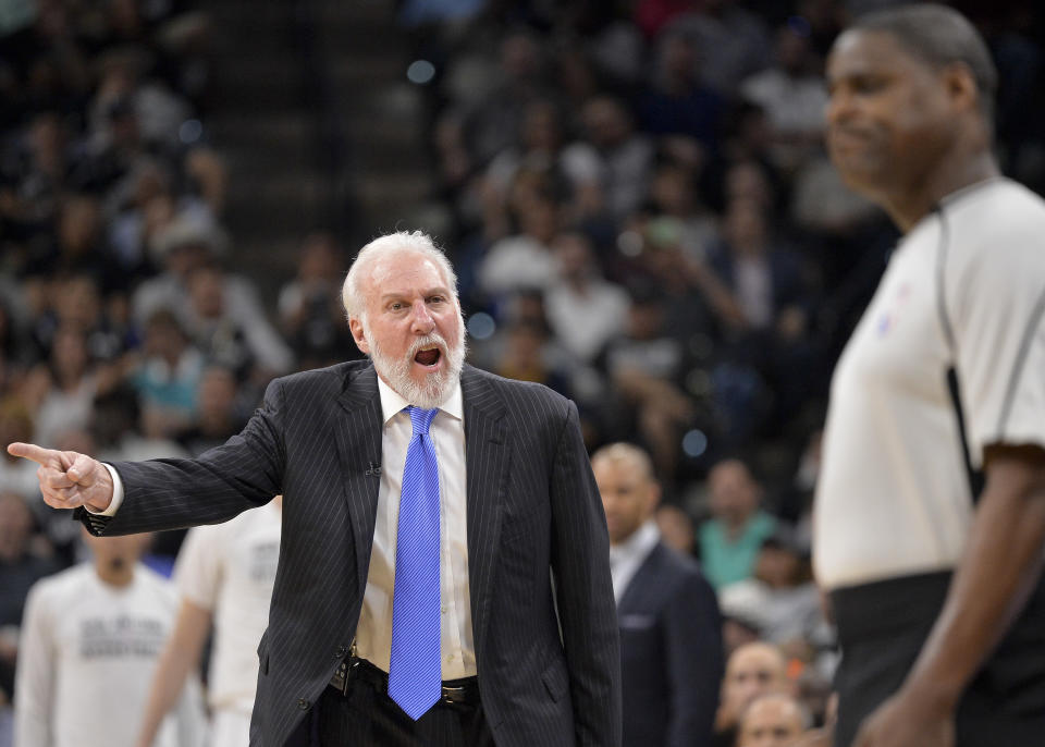 San Antonio Spurs head coach Gregg Popovich, left, argues a call with referee Leroy Richsardson during the first half of an NBA basketball game against the Cleveland Cavaliers, Monday, March 27, 2017, in San Antonio. (AP Photo/Darren Abate)