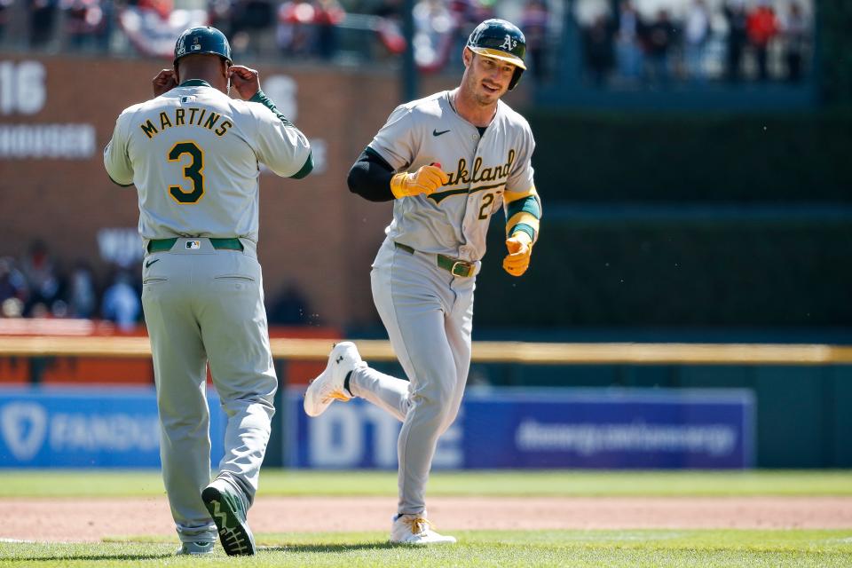 Oakland Athletics designated hitter Brent Rooker (25) celebrates after hitting a 2-run home run against Detroit Tigers during the first inning at Comerica Park in Detroit on Saturday, April 6, 2024.