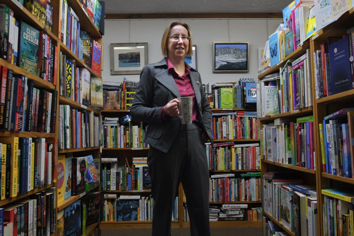 Booklovers' Gourmet Owner Deb Horan is pictured in her Webster bookstore at 55 East Main St. in 2018. The shop has since moved to 72 East Main St.