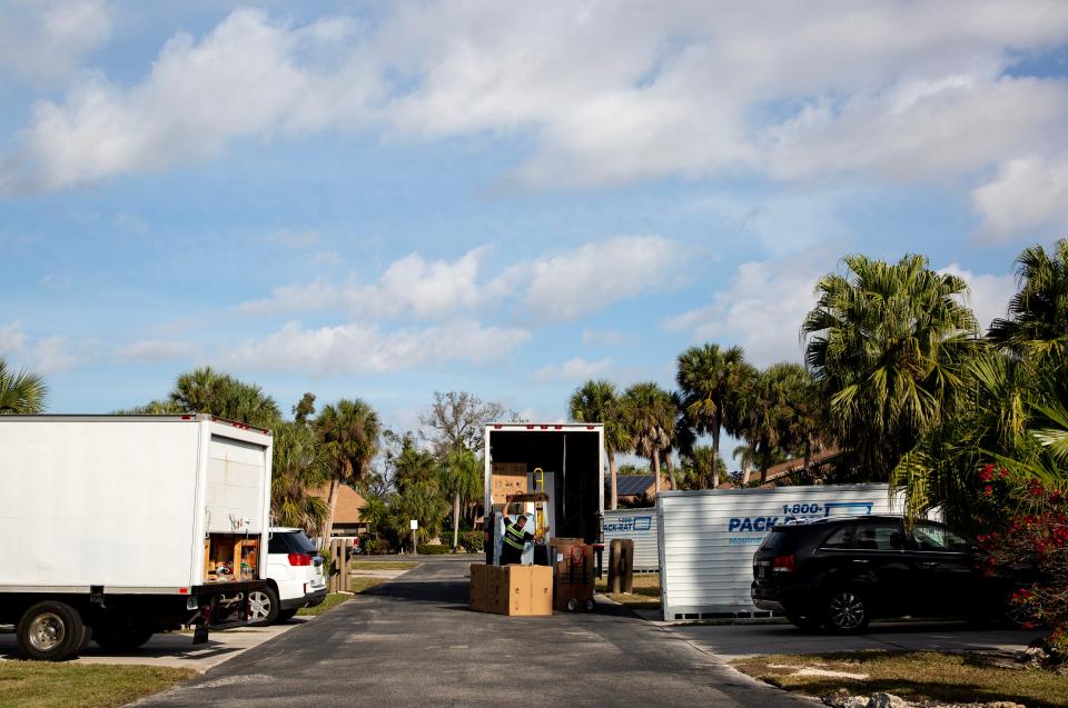 A delivery driver unloads new appliances for a resident in Island Park Village on Friday, Jan. 5, 2024, in Fort Myers. Many residents are still finishing or awaiting repairs on their homes that were damaged in Hurricane Ian.