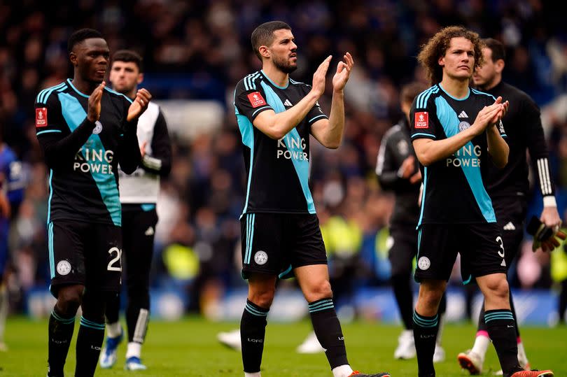 Conor Coady, centre, is keeping a close eye on Leeds United's results in the run-in -Credit:PA