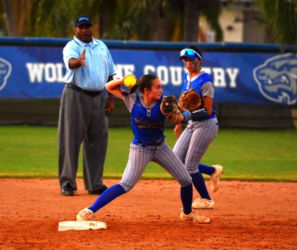 Wellington shortstop Maddie Touchet fields the ball and fires to first base for an unassisted double play during a game against Doral Academy on April 26, 2024.