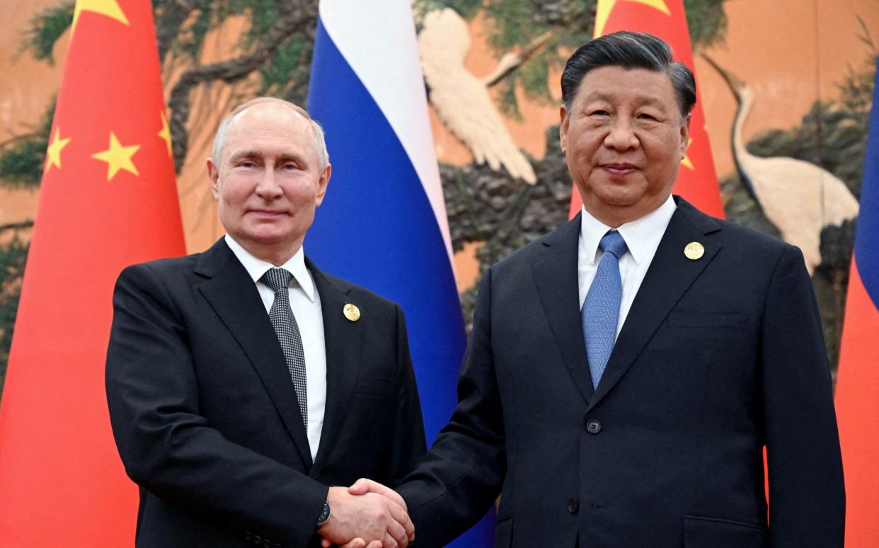 Russian President Vladimir Putin shakes hands with Chinese President Xi Jinping during a meeting at the Belt and Road Forum in Beijing, China, October 18, 2023.