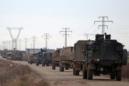 FILE PHOTO: Turkish military vehicles drive in the Syrian rebel-held town of al-Rai, as they head towards the northern Syrian town of al-Bab, Syria January 9, 2017. REUTERS/Khalil Ashawi/File Photo