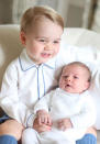 <p>Taken by mom the Duchess of Cambridge, Prince George smiles big as he embraces his baby sister in one of their first official portraits together. </p>