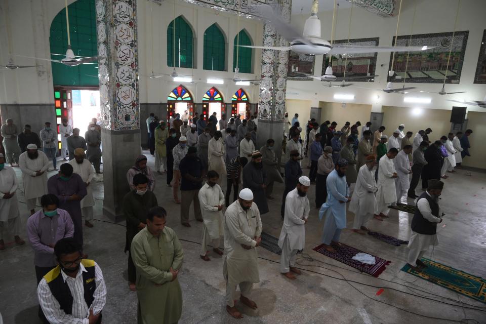 Muslim devotees offer Friday prayers at a mosque during the Islamic holy month of Ramadan in Lahore on May 8. (Photo: ARIF ALI via Getty Images)