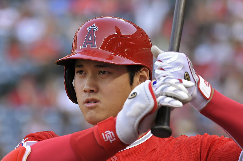 Los Angeles Angels' Shohei Ohtani, of Japan, warms up in the on-deck circle during the first inning of a baseball game against the Oakland Athletics, Saturday, Aug. 11, 2018, in Anaheim, Calif. (AP Photo/Mark J. Terrill)