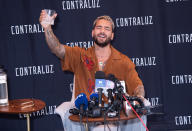 <p>Maluma raises a glass at a press conference for Contraluz Cristalino Mezcal on Aug. 10 in N.Y.C. </p>