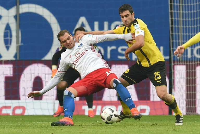 Dortmund's Greek defender Sokratis (R) and Hamburg's forward Pierre-Michel Lasogga vie for the ball in Hamburg, northern Germany, on November 5, 2016