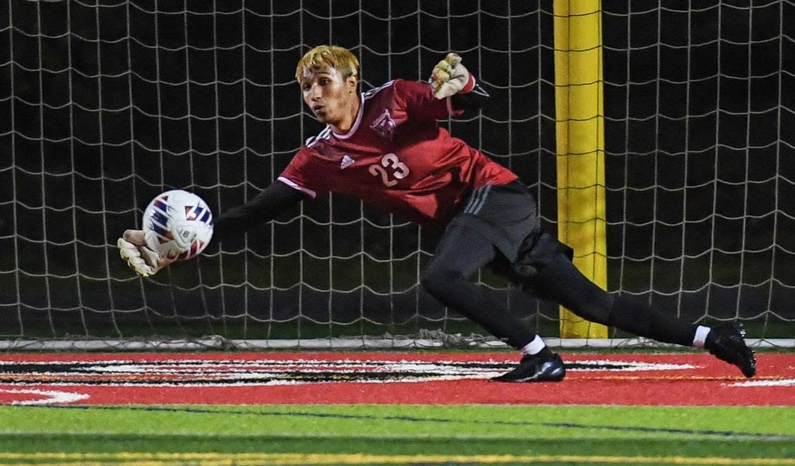 McLane goal keeper Christian Martinez blocks a shot during their Central Section Division III boys soccer championship game against Chavez at McLane Stadium on Friday, Feb. 24, 2023.