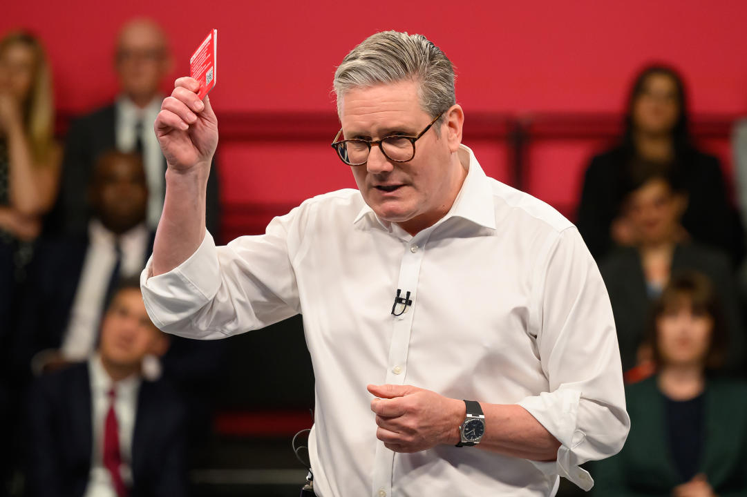 PURFLEET, ENGLAND - MAY 16: Labour Party Leader Keir Starmer holds a card featuring the six election pledges during the launch event on May 16, 2024 in Purfleet, England. Labour Leader Keir Starmer pledges to deliver economic stability, cut NHS waiting times, launch a new Border Security Command, set up Great British Energy and recruit 6,500 new teachers if Labour win the next General Election. (Photo by Leon Neal/Getty Images)