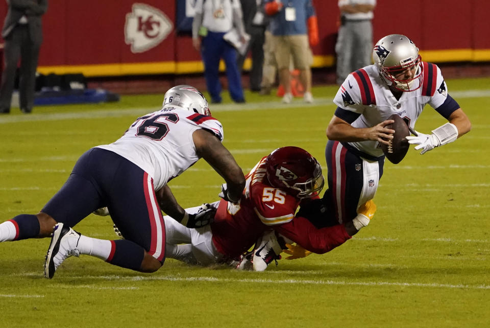 Brian Hoyer goes down as Frank Clark wraps up his legs for a sack.