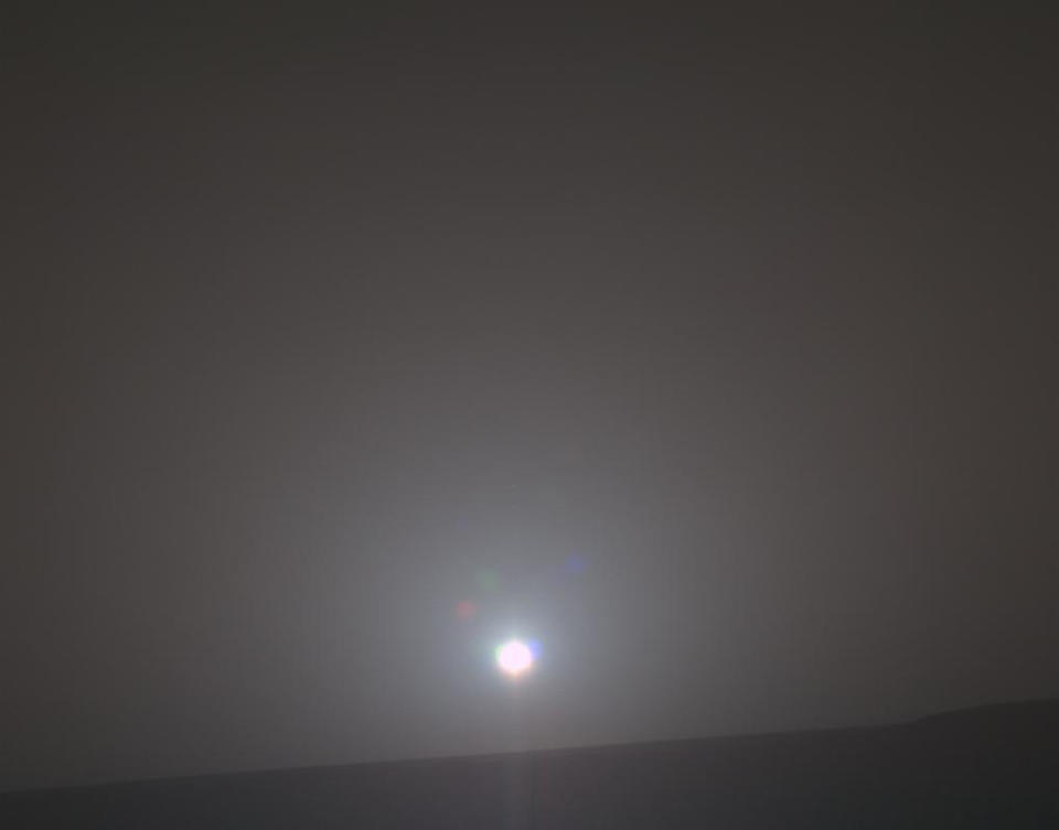 In this Feb. 15, 2018 photo made available by NASA, the sun rises as seen by the Mars Exploration Rover Opportunity. This is a processed, approximately true-color scene. (NASA/JPL-Caltech/Cornell/Arizona State University/Texas A&M via AP)