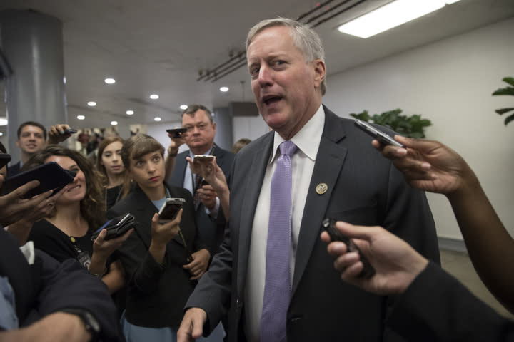 Rep. Mark Meadows, R-N.C., chairman of the conservative House Freedom Caucus, is stopped by reporters as he passes by the Senate. (Photo: J. Scott Applewhite/AP)