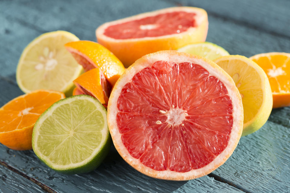 Citrus fruits arranged of a wooden table.