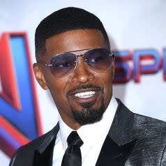 Jamie Foxx smiles at the Hollywood premiere of SpiderMan: No Way Home