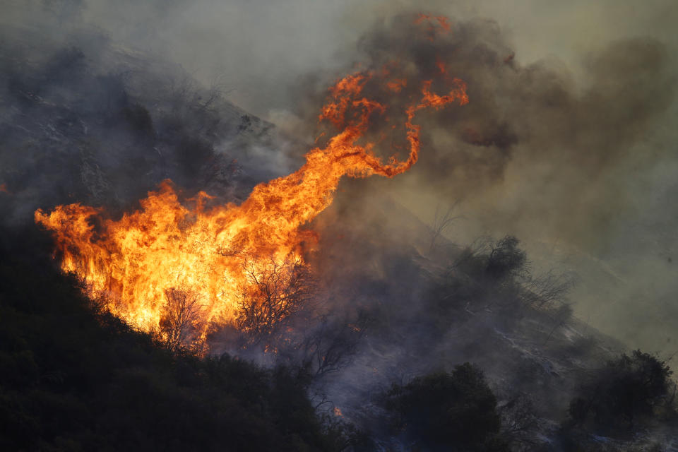 The Getty fire burns on Mandeville Canyon Monday, Oct. 28, 2019, in Los Angeles. (AP Photo/Marcio Jose Sanchez)