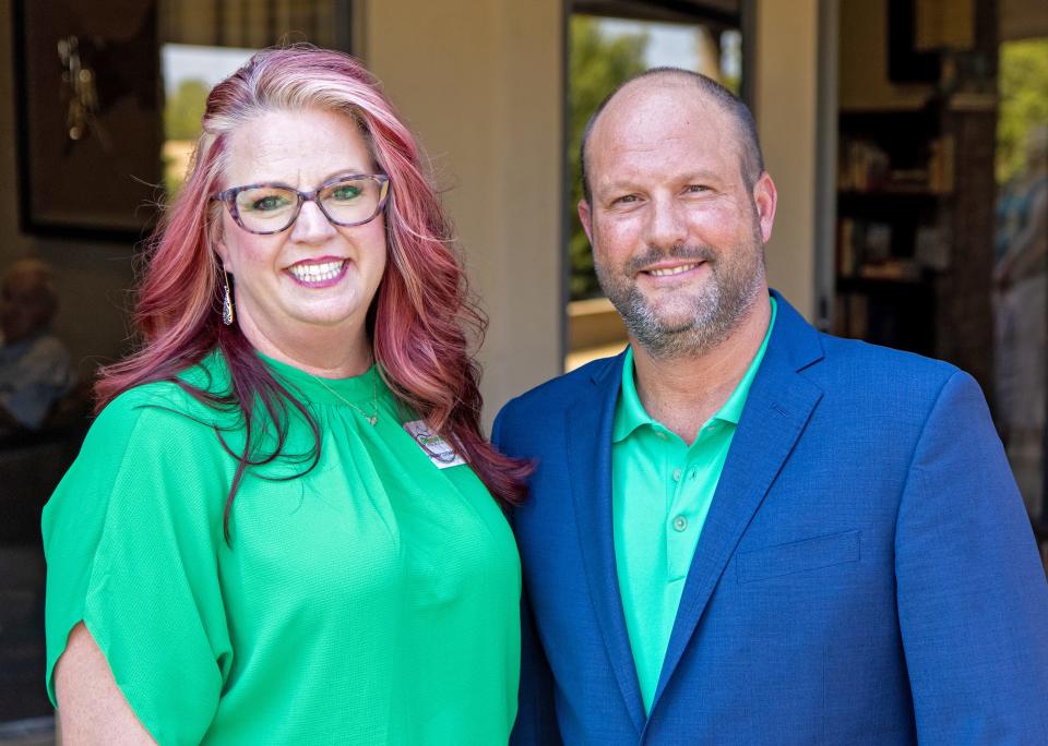 Stephany Cochran, executive director at the Green Shoe Foundation, and Chad Richison, founder, visit at the opening of the mental health retreat's new home in Guthrie.