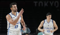 Italy's Giampaolo Ricci (17), left, celebrates a score against Nigeria during men's basketball preliminary round game at the 2020 Summer Olympics, Saturday, July 31, 2021, in Saitama, Japan. (AP Photo/Eric Gay)