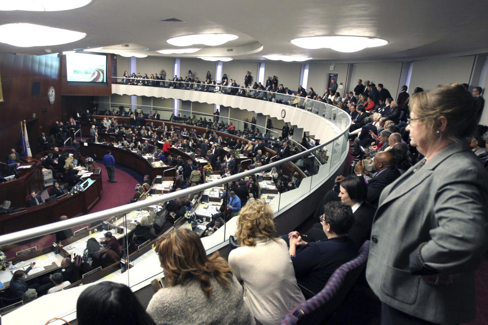 FILE - In this Feb 6, 2017, file photo, spectators look watch the Nevada State Assembly on the opening day of the Legislative Session in Carson City, Nev. Nevada became the first state in the U.S. with an overall female-majority in the Legislature on Tuesday, Dec. 18, 2018, when county officials in Las Vegas appointed two women to fill vacancies in the state Assembly. (AP Photo/Lance Iversen, File)