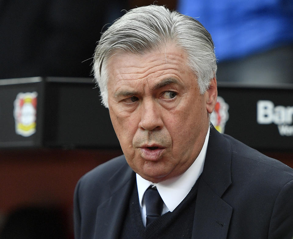 FILE - In this April 15, 2017 fiel photo Bayern head coach Carlo Ancelotti arrives to the German Bundesliga soccer match between Bayer Leverkusen and Bayern Munich in Leverkusen, Germany. The eyes of the footballing world will be on Verona where Cristiano Ronaldo is expected to make his Serie A debut when Chievo Verona hosts Juventus. Ronaldo has moved from Real Madrid to Juventus in a Serie A record 112 million-euro ($131.5 million) deal and is expected to make the Bianconeri even more dominant in Serie A. Carlo Ancelotti is back in Italian football after a nine-year absence and the new Napoli coach is keen to ensure that doesn’t happen. (AP Photo/Martin Meissner, file)