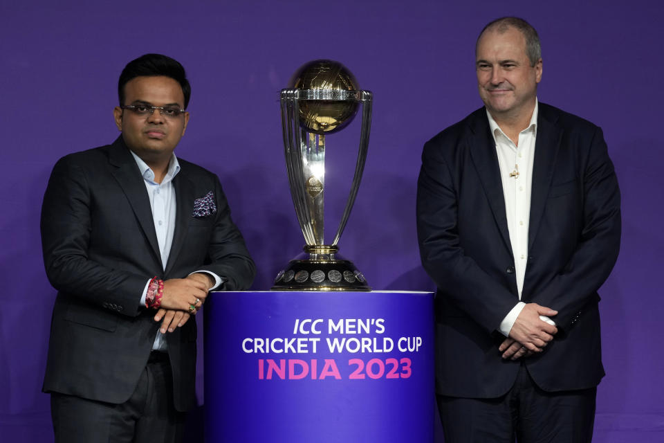 International Cricket Council (ICC) chief executive Geoff Allardice, right and Board of Control for Cricket in India (BCCI) secretary, Jay Shah pose with the men’s cricket World Cup trophy during a press conference to release the tournament's match schedule in Mumbai, India, Tuesday, June 27, 2023. Ten teams will feature in the 46-day tournament which is being held across 10 cities in India. (AP Photo/Rajanish Kakade)