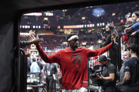 Toronto Raptors forward Pascal Siakam greets fans as he comes off the court after his team's 100-88 win over Cleveland Cavaliers in an NBA basketball game in Toronto, Monday, Nov. 28, 2022. (Chris Young/The Canadian Press via AP)