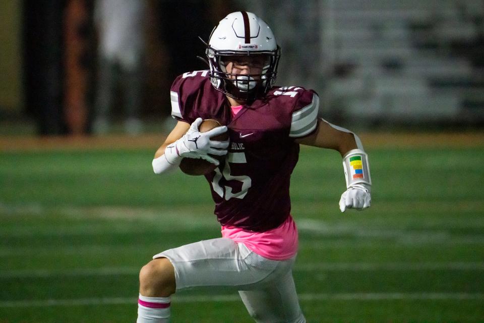 Dowling Catholic's Trey Wilson carries the ball. The Maroons are coming off a state semifinal apperance in 2022, but need to find a new quarterback.