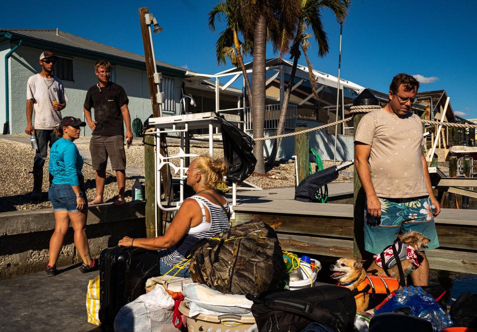 Residents of Pine Island wait to be ferried to Fort Myers following Hurricane Ian on Oct. 2, 2022. 