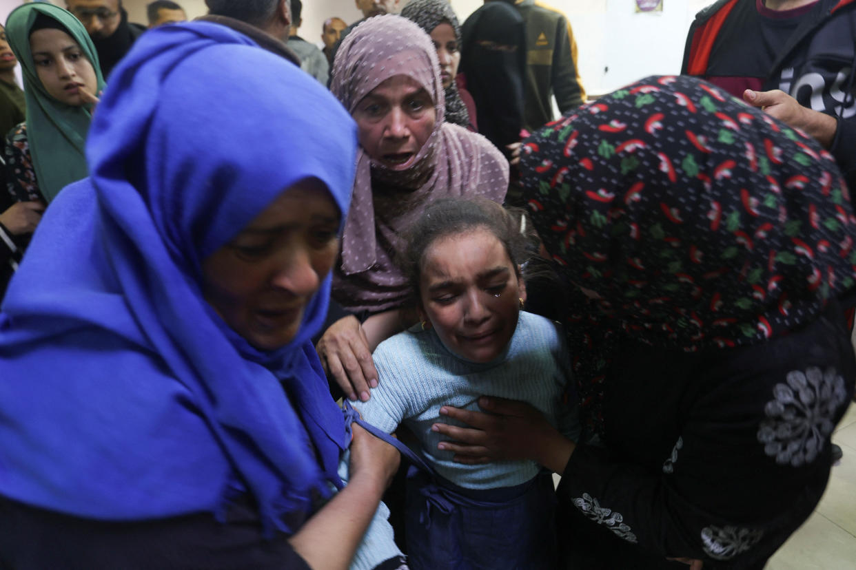 People react as they rush to the hospital following an Israeli strike, amid the ongoing conflict between Israel and the Palestinian Islamist group Hamas, at Nasser hospital in Khan Younis in the southern Gaza Strip, December 3, 2023. REUTERS/Ibraheem Abu Mustafa