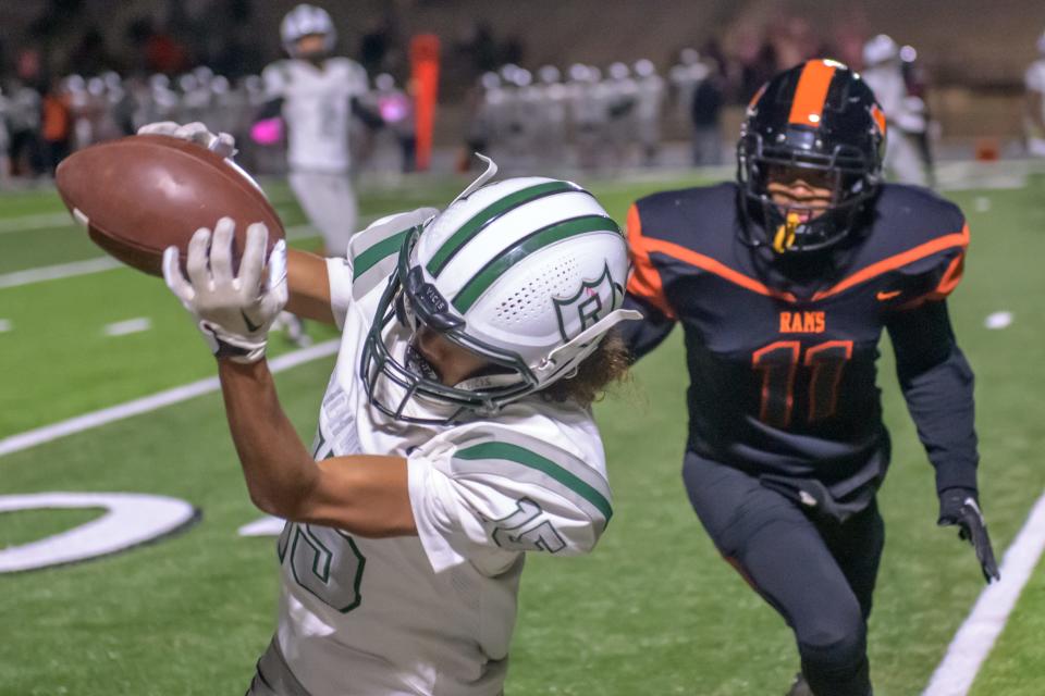 Richwoods receiver Amari Johnson catches a pass last season against Manual. Johnson is one of the Peoria area's top returning receivers in 2024.