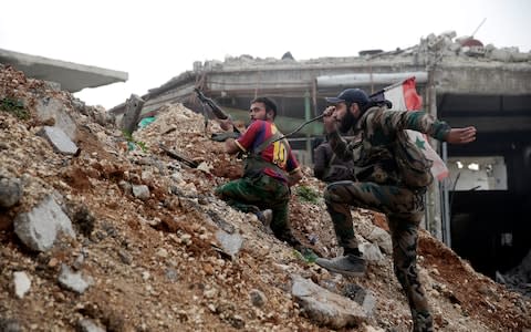 The Afghan militias were thrown into the battle for Aleppo alongside regular Syrian forces, seen here during fighting in the city in 2016 - Credit: &nbsp;Hassan Ammar/&nbsp;AP&nbsp;