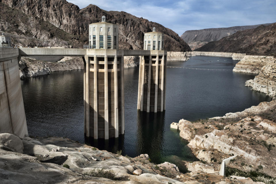 FILE - This March 26, 2019, file photo, shows a bathtub ring of light minerals showing the high water mark of the reservoir which has shrunk to its lowest point on the Colorado River, as seen from the Hoover Dam, Ariz. As persistent drought and climate change threaten the Colorado River, several states that rely on the water acknowledge that they likely won't get what they were promised a century ago. (AP Photo/Richard Vogel,File)