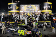 Jimmie Johnson, driver of the #48 Lowe's/Kobalt Tools Chevrolet, celebrates with his crew members after winning the 2008 NASCAR Sprint Cup Series Championship after the Ford 400 at Homestead-Miami Speedway on November 16, 2008 in Homestead, Florida. (Photo by John Harrelson/Getty Images for NASCAR)