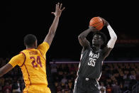 Washington State forward Mouhamed Gueye, right, shoots as Southern California forward Joshua Morgan defends during the first half of an NCAA college basketball game Thursday, Feb. 2, 2023, in Los Angeles. (AP Photo/Mark J. Terrill)