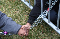 Protesters chain themselves to an entry point prior at the inauguration of U.S. President-elect Donald Trump in Washington, DC, U.S., January 20, 2017. REUTERS/Bryan Woolston