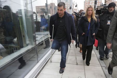 Boston Marathon bombing survivor Marc Fucarile (L) leaves the federal courthouse on the first day of the trial of accused bomber Dzhokhar Tsarnaev in Boston, Massachusetts March 4, 2015. REUTERS/Brian Snyder