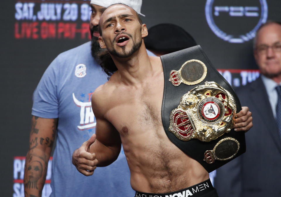 Keith Thurman holds a belt during a weigh-in Friday, July 19, 2019, in Las Vegas. Thurman is scheduled to fight Manny Pacquiao in a welterweight championship boxing match Saturday in Las Vegas. (AP Photo/John Locher)