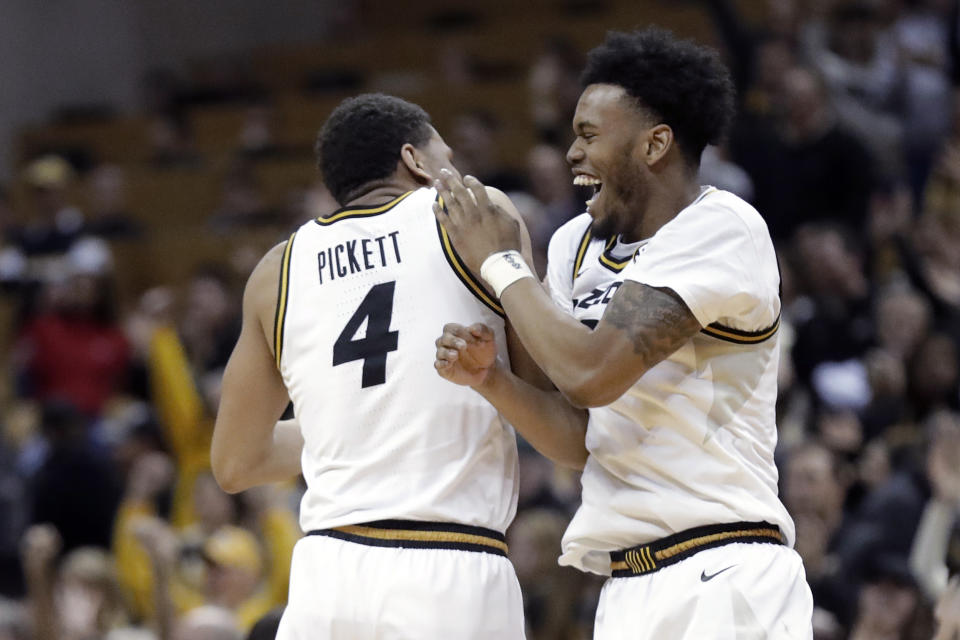 Missouri's Javon Pickett (4) and Torrence Watson celebrate the team's 72-69 victory over Georgia in an NCAA college basketball game Tuesday, Jan. 28, 2020, in Columbia, Mo. (AP Photo/Jeff Roberson)