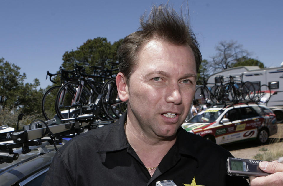 FILE - In this April 29, 2009, file photo, Astana cycling team general manager Johan Bruyneel answers questions from the media after the first stage of the Tour of the Gila cycling race in Mogollon, N.M. In a letter posted on social media Wednesday, Oct. 24, 2018, Bruyneel, Lance Armstrong’s former team manager, said he’s been given a lifetime ban from cycling for his role in a doping program that helped Armstrong win the Tour de France seven times. (AP Photo/Jake Schoellkopf, File)