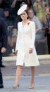 <p>For a ceremony at the Commonwealth War Graves Commission Ypres Memorial in Ypres, Belgium, Kate wore a white coatdress and fascinator. </p>