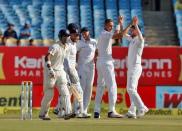 Cricket - India v England - First Test cricket match - Saurashtra Cricket Association Stadium, Rajkot, India - 11/11/16. England's Stuart Broad (2nd R) celebrates taking India's Gautam Gambhir wicket. REUTERS/Amit Dave