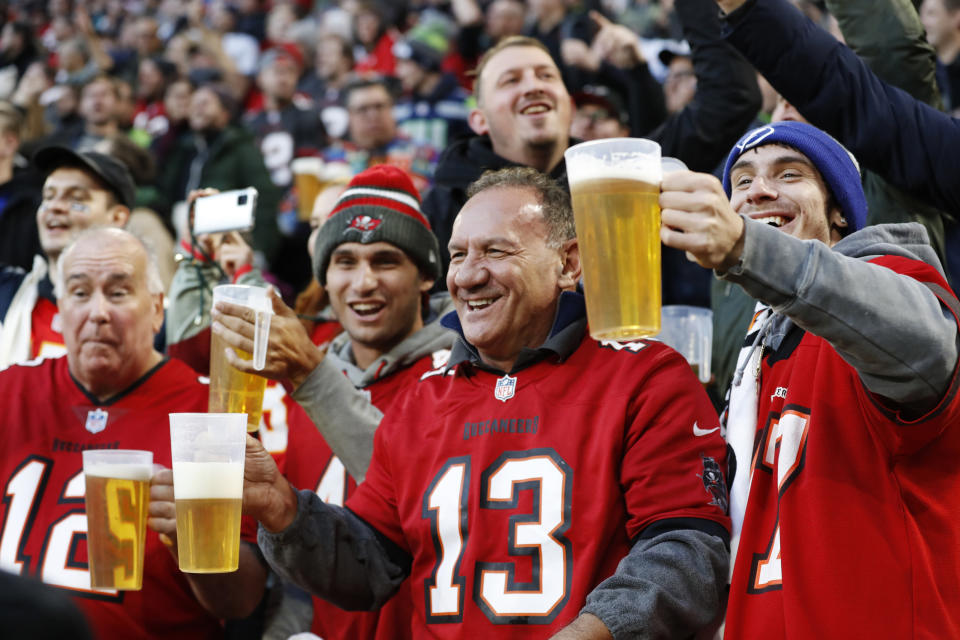 FILE - Fans cheer during an NFL football game between the Tampa Bay Buccaneers and the Seattle Seahawks at Allianz Arena in Munich, Germany, Sunday, Nov. 13, 2022. The NFL says there are millions of German fans who are looking for a team to support. The Chiefs go first — they’ll play the Miami Dolphins on Sunday. A week later, the Patriots face the Indianapolis Colts. Both games are at Deutsche Bank Park. (AP Photo/Steve Luciano, File)