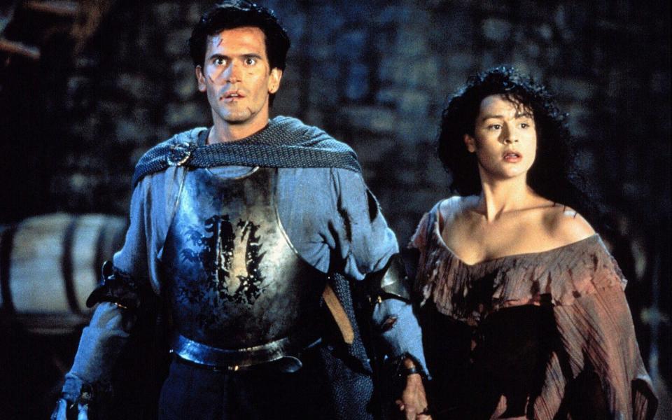 Bruce Campbell and Embeth Davidtz in Army of Darkness - Alamy/Bruce Campbell and Embeth Davidtz in Army of Darkness