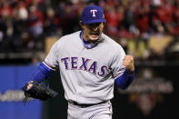 ST LOUIS, MO - OCTOBER 27: Derek Holland #45 of the Texas Rangers reacts after getting the last out of the sixth inning during Game Six of the MLB World Series against the St. Louis Cardinals at Busch Stadium on October 27, 2011 in St Louis, Missouri. (Photo by Ezra Shaw/Getty Images)