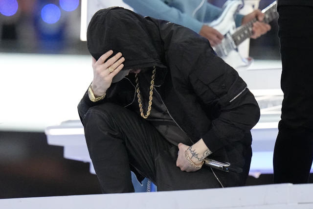 Super Bowl: Eminem takes a knee, 50 Cent hangs upside down