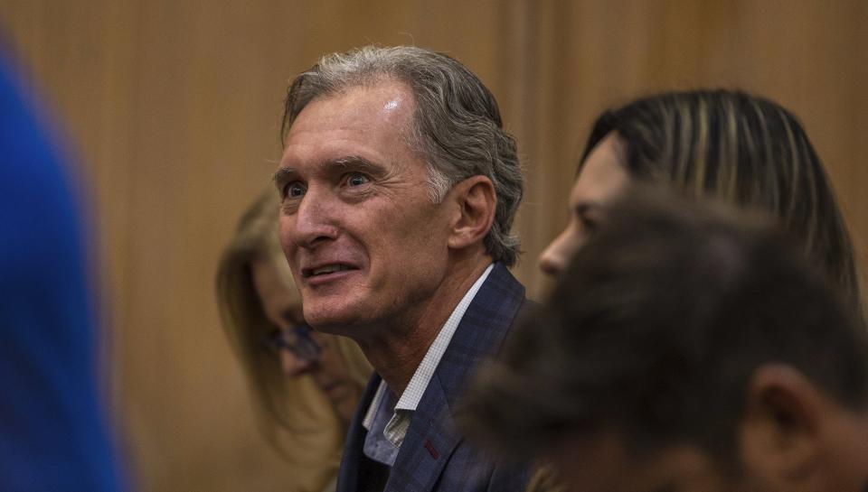 Kim Clenney, the father of the OnlyFans model Courtney Clenney, reacts during a hearing in front of Judge Laura Shearon Cruz, where the computer hacking charges against himself, his daughter and his wife, Deborah Clenney, were dismissed at the Gerstein Justice Building, Thursday, July 11, 2024, in Miami. Courtney Clenney is accused of stabbing to death her boyfriend in a Miami condo in 2022. The murder charge has not been dropped. (Pedro Portal/Miami Herald via AP)